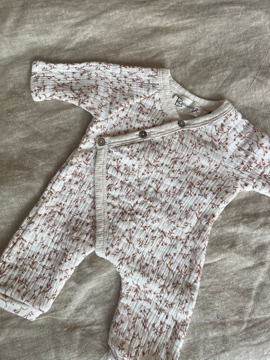 Baby jumpsuit with floral print